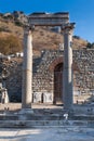 Classic White Roman Pillars at fallen Temple Door with statue de