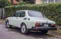 Classic white Saab 99 car parked