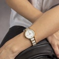 classic white women& x27;s watch in a golden frame on a woman& x27;s hand. Royalty Free Stock Photo