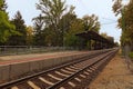 Classic wide-angle view of empty railway train station in resort town Balatonfoldvar. Autumn landscape view. Royalty Free Stock Photo