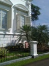 Classic window shapes and gardens next to Bogor palace