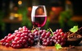Fine Red Wine Served With Grapes and Leaves on Wooden Table Under Soft Warm Lighting Royalty Free Stock Photo