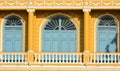 Classic wood window at the yellow concrete building. Royalty Free Stock Photo