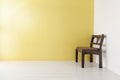 Classic wooden chair on yellow wall Royalty Free Stock Photo