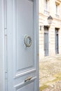 Classic wooden door of old bourgeois houses of city centers in France like Paris or Bordeaux