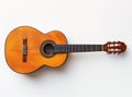 A classic wooden guitar isolated on a white background, showcasing its detailed craftsmanship and elegant design. Royalty Free Stock Photo