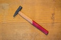Classic Wooden Hammer on Rustic Wooden Surface Royalty Free Stock Photo