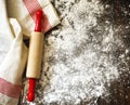 Classic wooden rolling pin and dusting of flour on wooden background Royalty Free Stock Photo