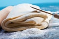 Classic wooden rolling pin with freshly prepared dough and dusting of flour on black background Royalty Free Stock Photo