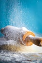 Classic wooden rolling pin with freshly prepared dough and dusting of flour on black background Royalty Free Stock Photo