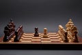 Classic Wooden Tournament chess set on black background. Two pawns in centre of board other pieces lined up Royalty Free Stock Photo