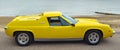 Classic Yellow Lotus Europa Motor Car Parked on Seafront Promenade. Royalty Free Stock Photo