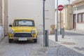 A classic yellow mini cooper parked Royalty Free Stock Photo