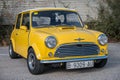 classic yellow Morris Mini Cooper S 1300 with a white roof Royalty Free Stock Photo