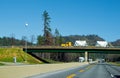 Classic yellow semi truck bulk trailers on bridge across interstate highway I-5 Oregon Royalty Free Stock Photo