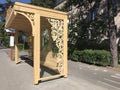 A classic yellow wooden bus stop in Otwock, Poland - POLSKA