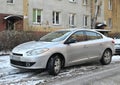 Classic youngtimer French convenient car silver grey Renault Fluence 1.6 1st generation parked Royalty Free Stock Photo