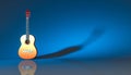 Classical acoustic guitar on a blue background Royalty Free Stock Photo