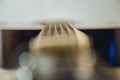 Classical acoustic guitar Detail of an acoustic guitar behind a white background vibrating strings Royalty Free Stock Photo