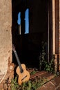 Classical acoustic guitar in ruins of abandoned church Royalty Free Stock Photo