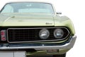 Classical american vintage car 1970 Ford Torino Coupe. Front lights detail. White background