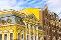 Classical architecture. Yellow brown buildings front view against a blue sky. Royalty Free Stock Photo