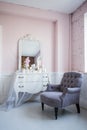 Classical armchair and mirror table at living room interior Royalty Free Stock Photo