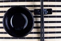 Classical asian chopsticks and black bowl Royalty Free Stock Photo