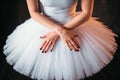 Classical ballet dancer in dress and cross hands