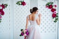 Classical beauty. Beautiful young woman with stylish brunette hair and elegant dress resting in luxury white classic Royalty Free Stock Photo