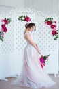 Classical beauty. Beautiful young woman with stylish brunette hair and elegant dress resting in luxury white classic Royalty Free Stock Photo