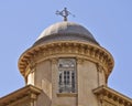 Classical building dome with Triton ancient Greek deity as wind vane