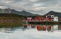 a classical building for stopping yacht travellers, fishing house of red color on the coast on Lofoten Islands, classic