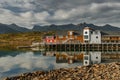 a classical building for stopping yacht travellers, fishing house of red color on the coast on Lofoten Islands, classic