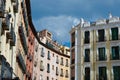 Classical buildings with balconies and windows with elegant ornate in downtown district of Madrid, Spain. Vivid colours, old-