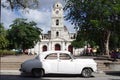Classical car in front of historical church