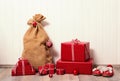 Classical christmas presents wrapped in red paper on white woode