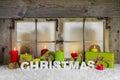 Classical christmas window with candles and presents for xmas. Royalty Free Stock Photo