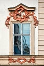 Classical colorful window with pediment in Prague