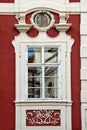 Classical colorful window with pediment in Prague