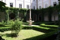 Classical Fountain surrounded by garden. Innsbruck, Austria, August 5, 2013.