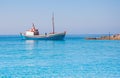 Classical Greek fishing boat in the blue sea Royalty Free Stock Photo