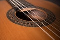 Classical guitar on black background. Acoustic guitar concept.Perfect for flyer, card, poster or wallpaper