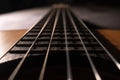 Classical guitar on black background. Acoustic guitar concept.Perfect for flyer, card, poster or wallpaper