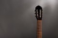 Classical guitar on a grey mottled background with negative space for copy