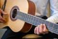 Classical guitar - Guitarist playing acoustic guitar in studio Royalty Free Stock Photo