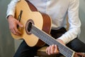 Classical guitar - Guitarist playing acoustic guitar in studio Royalty Free Stock Photo