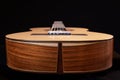 Classical guitar isolated on black background, view from the down side. Royalty Free Stock Photo