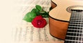 Classical guitar and rose. Royalty Free Stock Photo