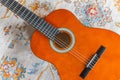 Classical guitar on rug